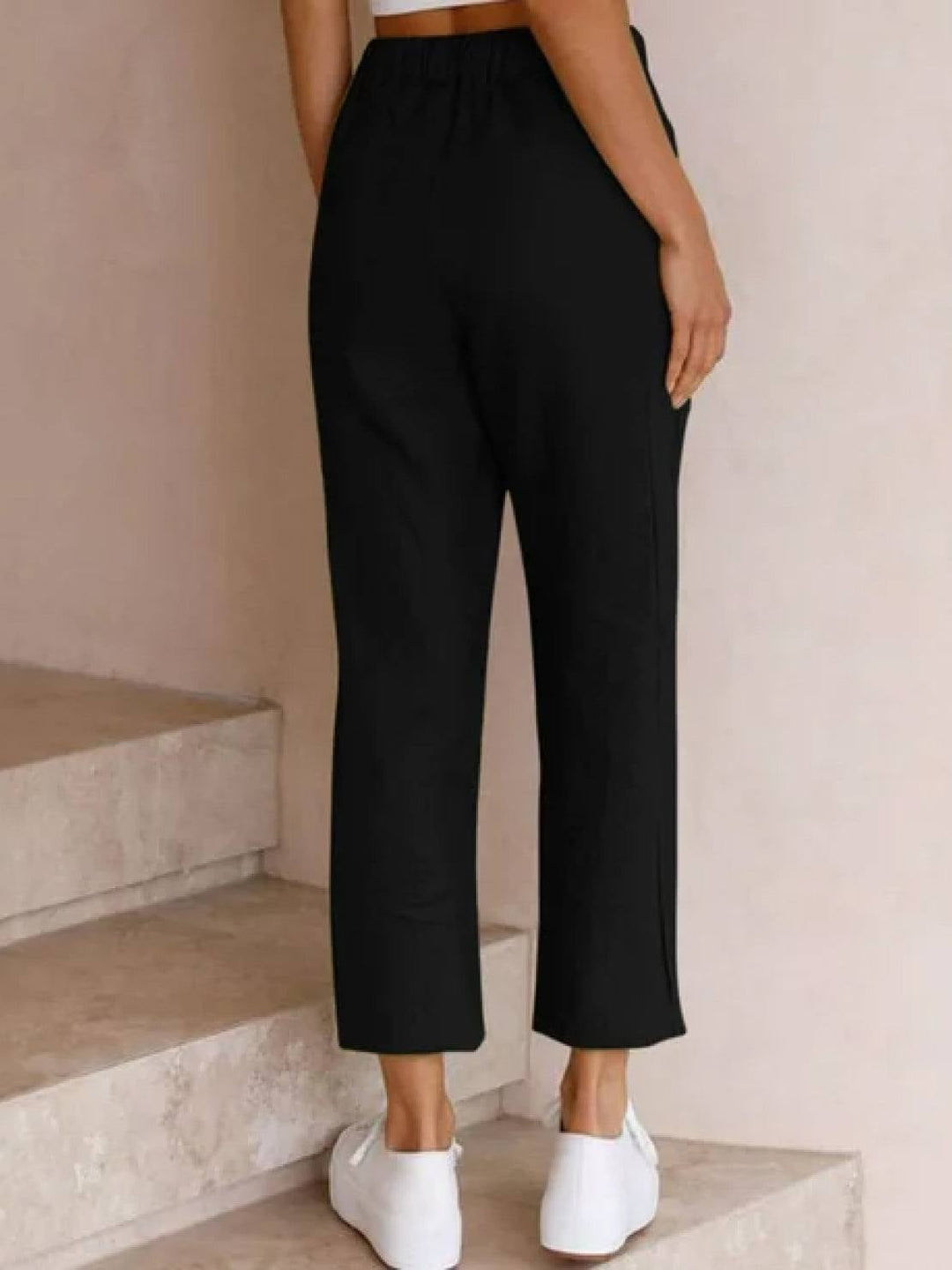 Back view of Harper casual drawstring pants in rusty orange
