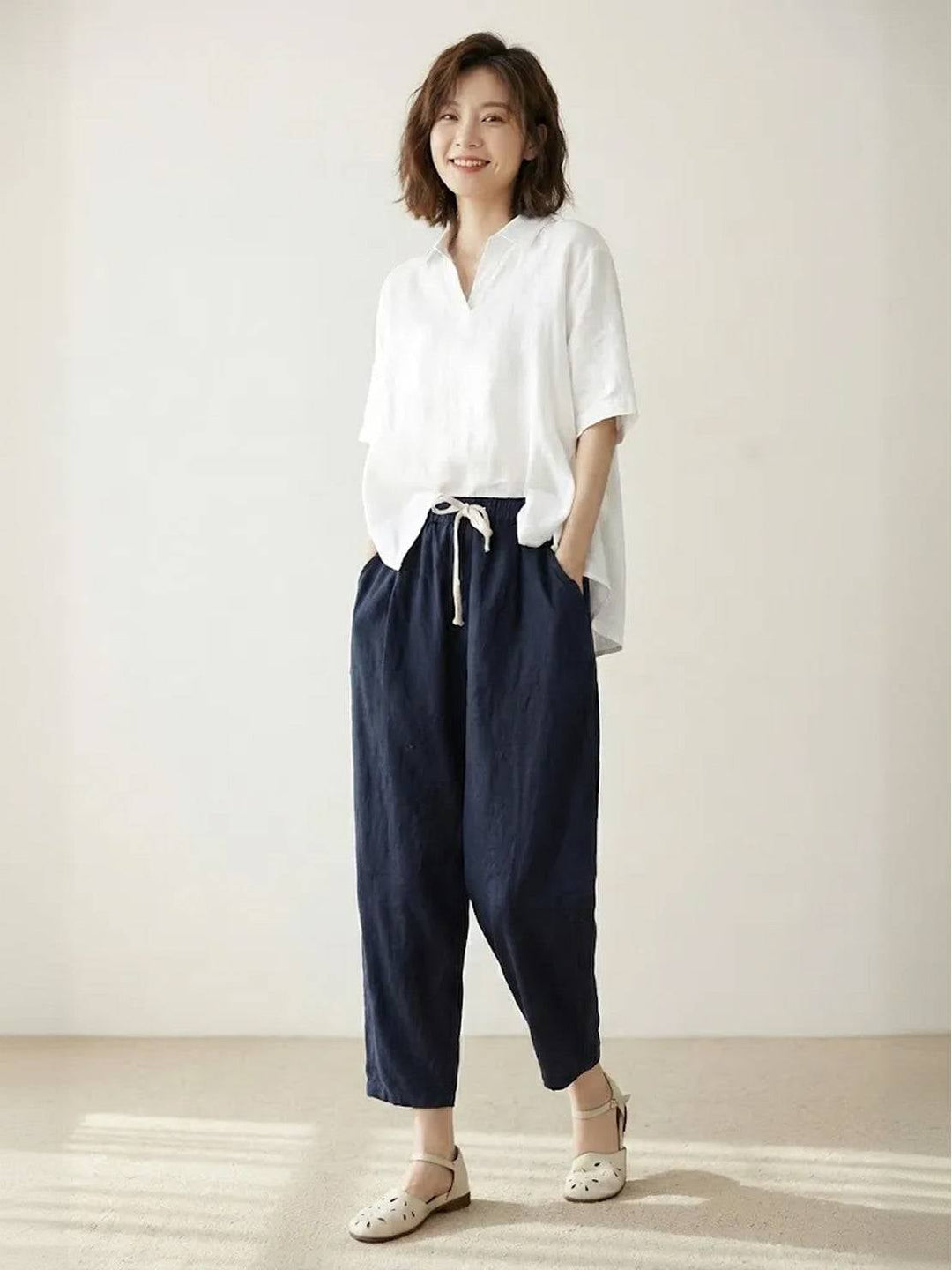Close-up of linen-look fabric texture on Harper pants in light blue