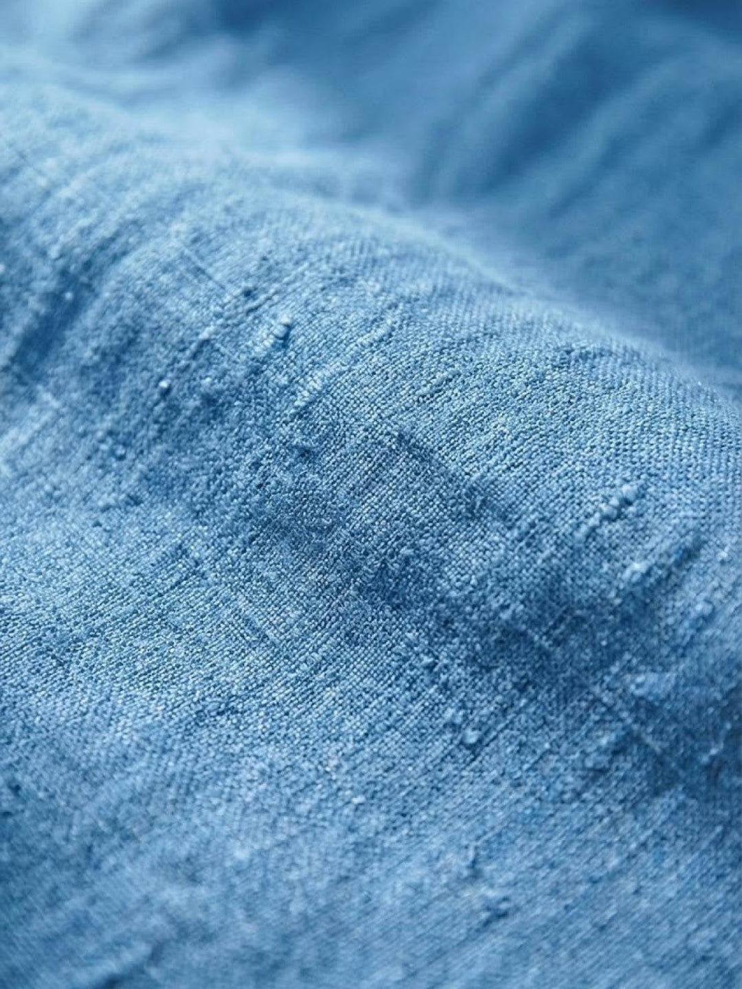 Close-up of roll-up hem cuff detail on Harper pants in army green