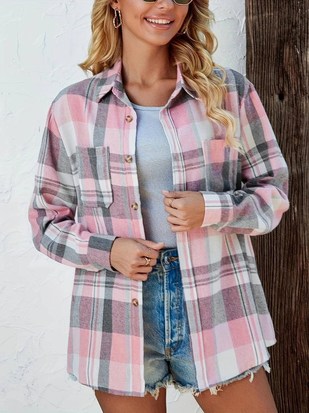 Close-up of horn-style button-down front and chest patch pocket on Harper flannel shirt in pink