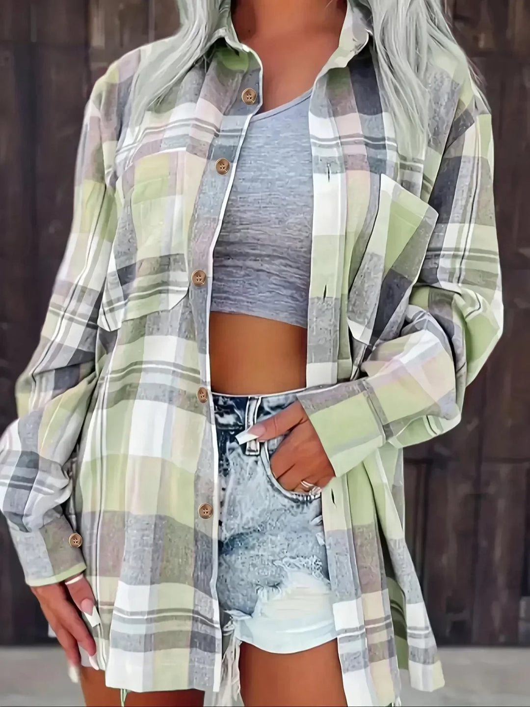 Harper plaid flannel shirt styled with high-waisted jeans, hem knotted at the front