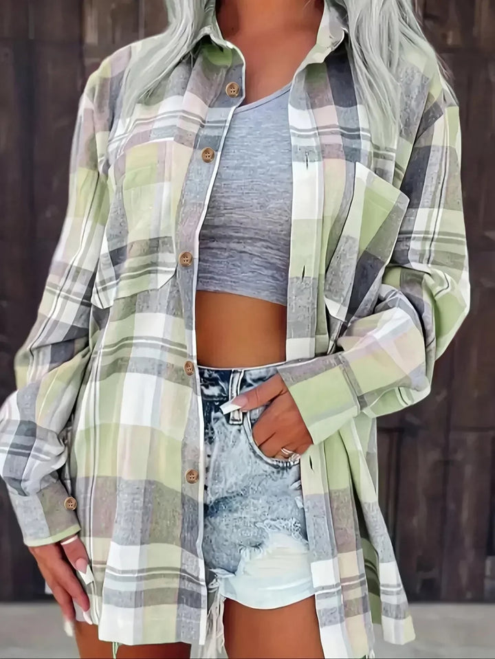 Harper plaid flannel shirt styled with high-waisted jeans, hem knotted at the front