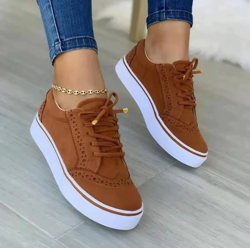 Harper women's platform sneaker in brown suede-look with brogue punch-out detailing and white flatform sole, front three-quarter view