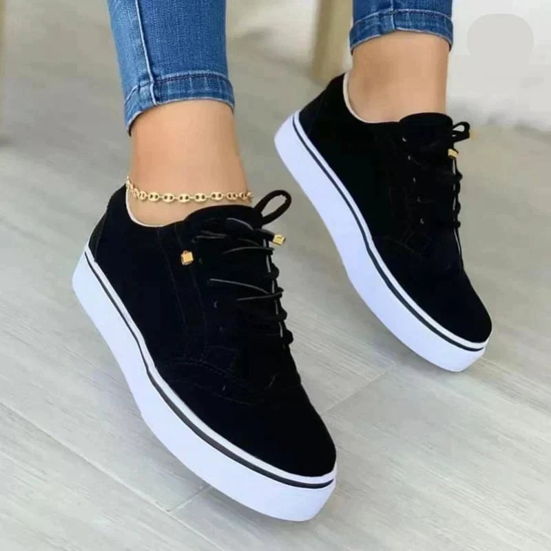 Harper women's lace-up brogue sneaker in black with perforated toe detailing, angled front view