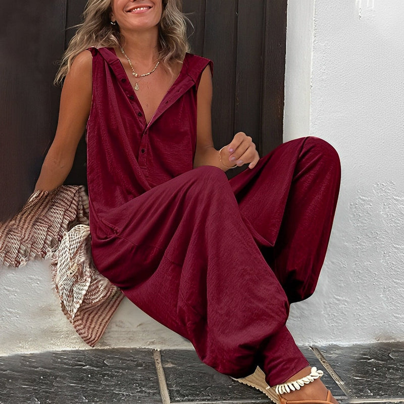 Close-up of the Harper jumpsuit showing the button-down V-neckline and hood detail