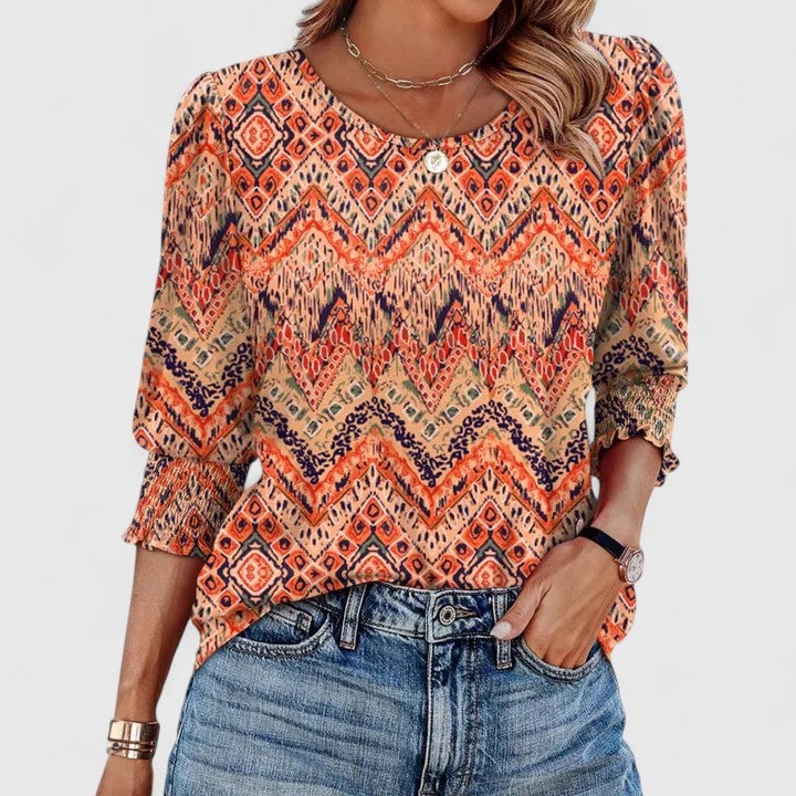 Harper top in leopard print with smocked cuff detail visible