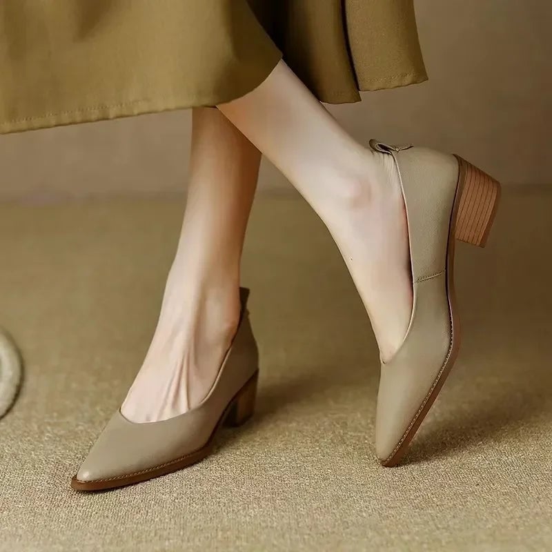 Harriet block heel pump in beige with pointed toe and rear pull-tab, side view
