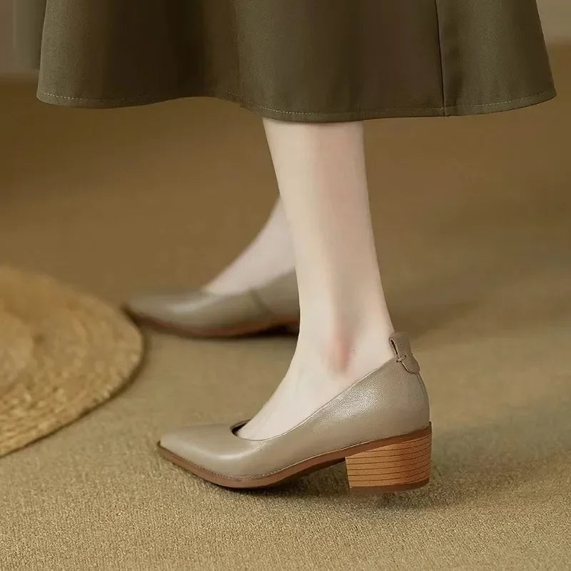 Harriet block heel pump in beige, top-down view showing sleek silhouette