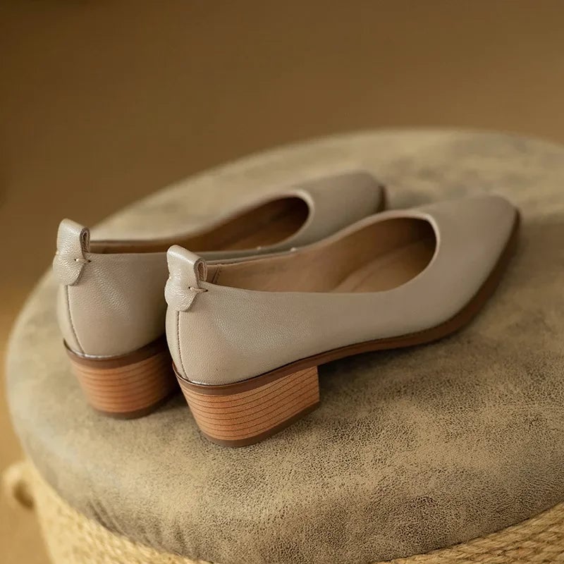Harriet block heel pump in beige on a flat surface, sole detail visible