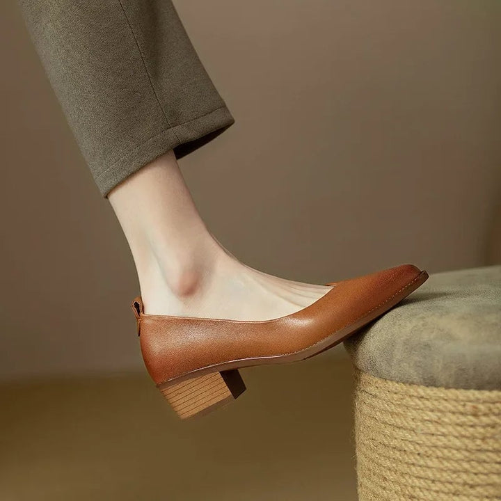 Harriet block heel pump in brown styled with a midi skirt, lifestyle shot