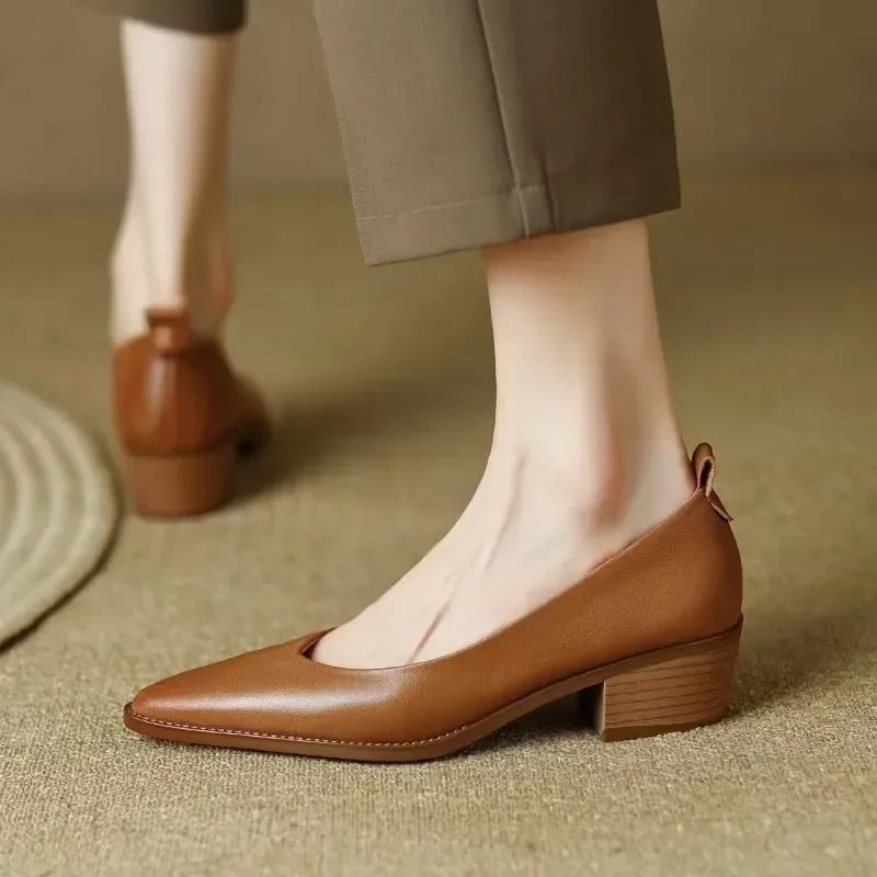 Both colorways of the Harriet block heel pump displayed side by side — beige and brown