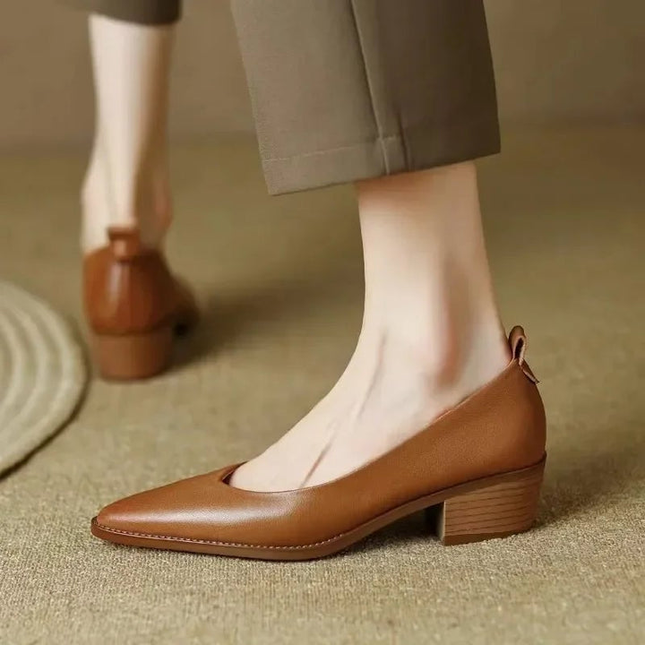 Both colorways of the Harriet block heel pump displayed side by side — beige and brown