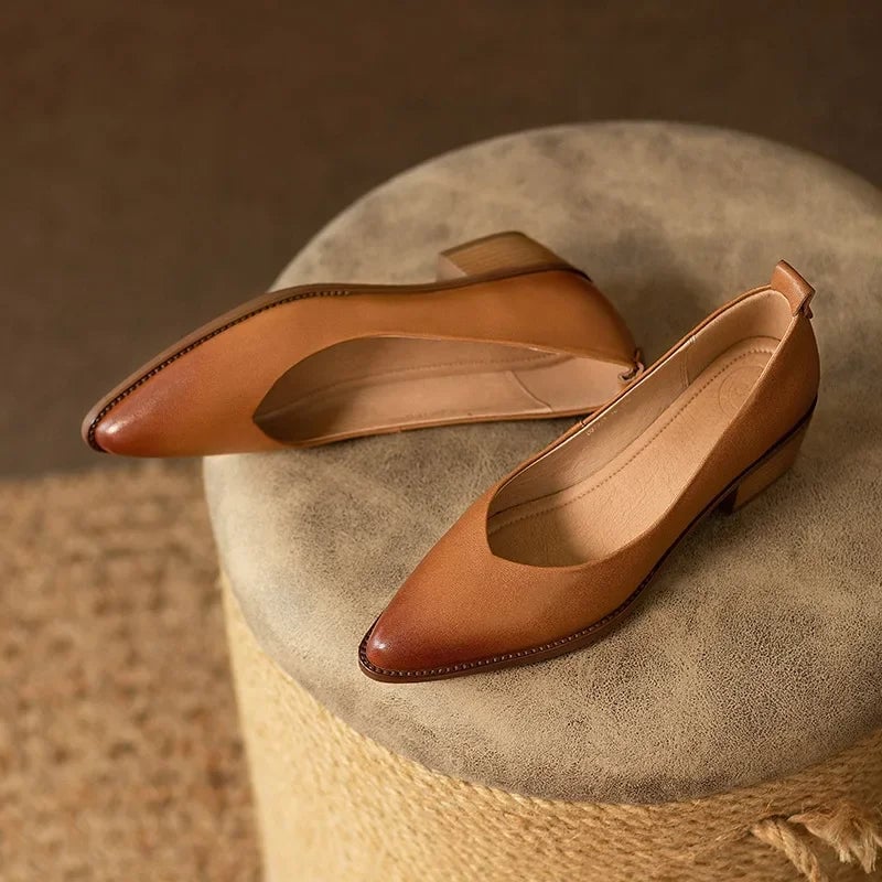 Close-up of the Harriet pump pull-tab and heel detail in brown