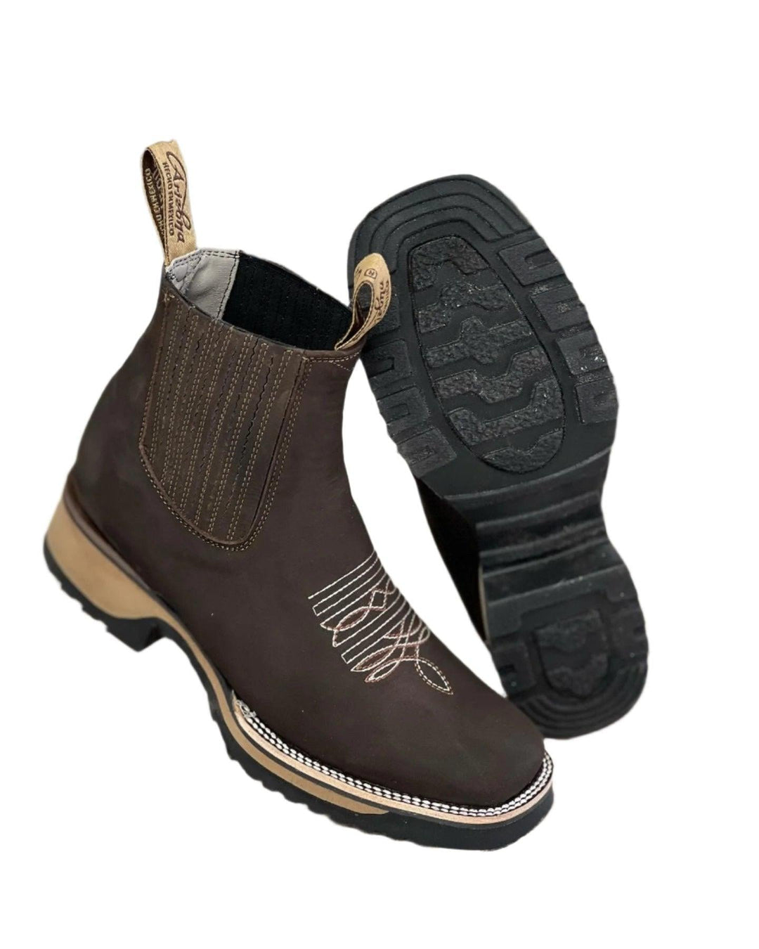 Haven cowboy boots in dark brown shown from a front three-quarter angle against a neutral background