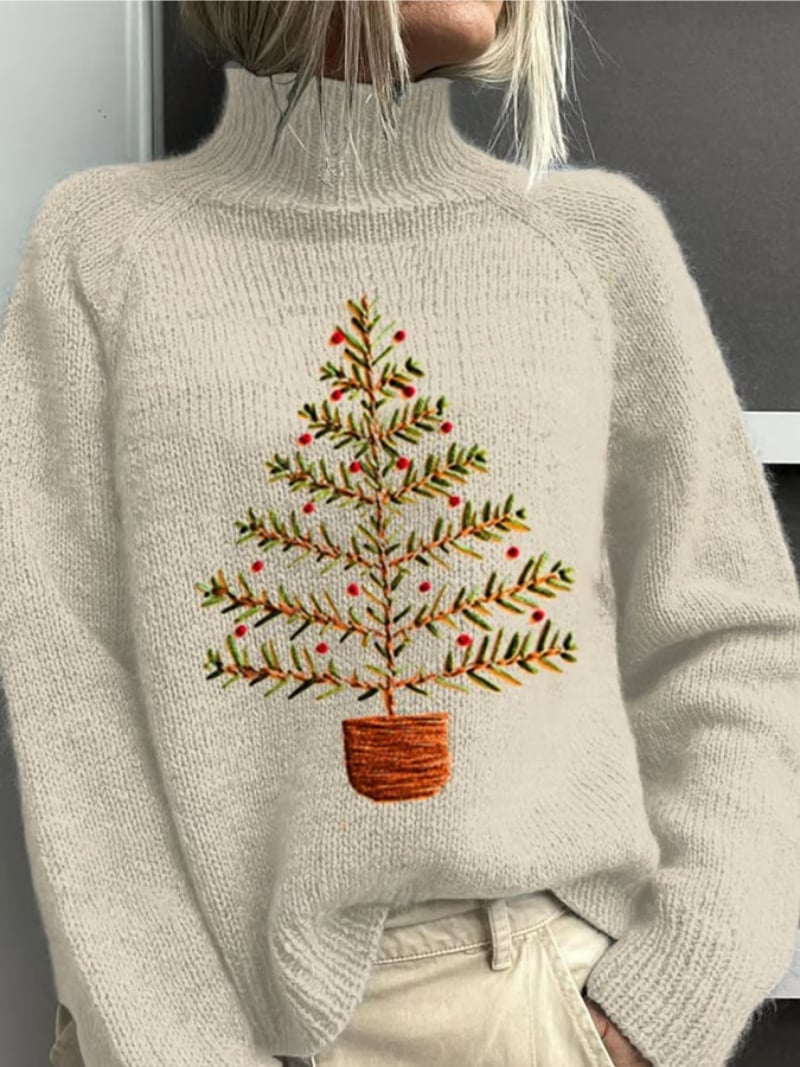 Woman wearing a cozy gray classic Christmas sweater with a festive holiday pattern, styled for a flattering fit