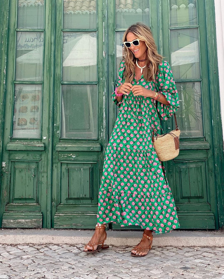 Front view of the Florimay effortless spring dress in green and white on a model