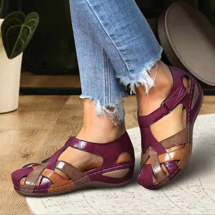 Haven women's sandal in red worn on foot showing secure fit and clean modern silhouette