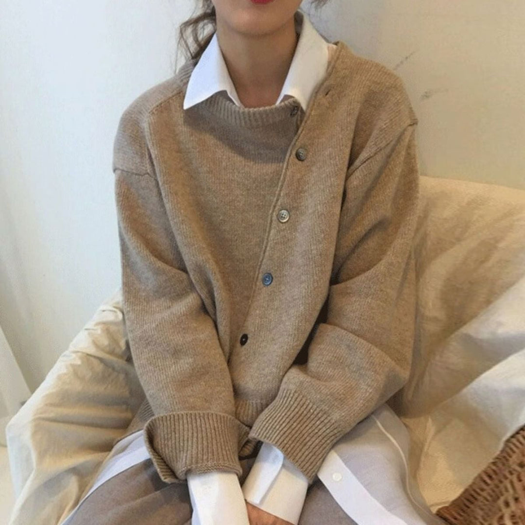 Model wearing the Hazel modern chic cardigan in brown with asymmetrical button detail, front view