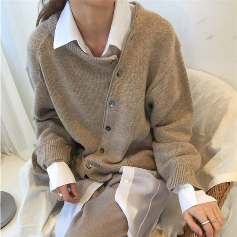 Hazel cardigan in green displayed to show its lightweight knit fabric and flattering silhouette