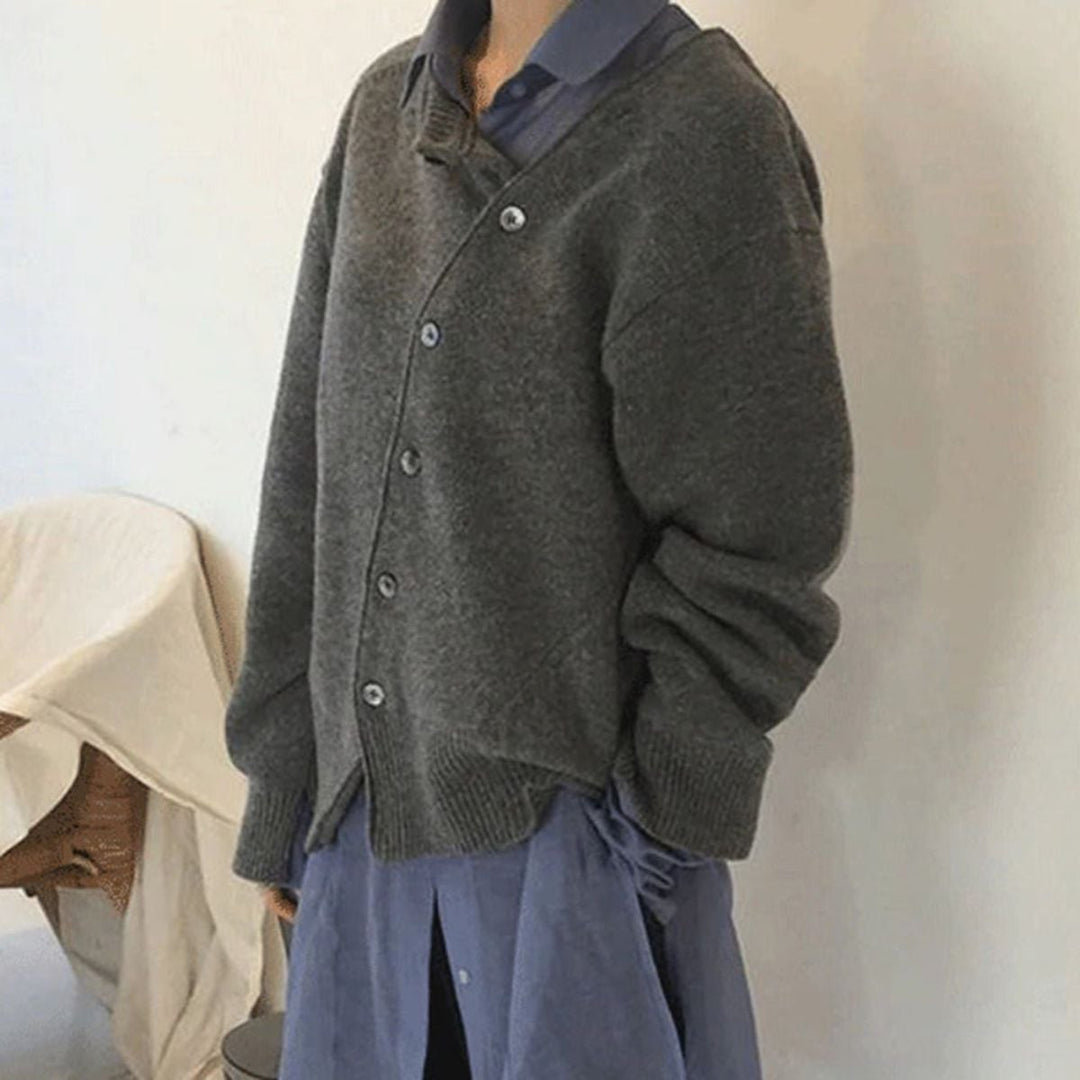 Model wearing the Hazel cardigan open as a layer over a simple top, side profile view