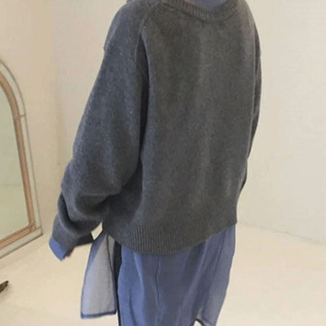 Flat lay of the Hazel chic cardigan in grey showing the asymmetrical button closure and knit texture