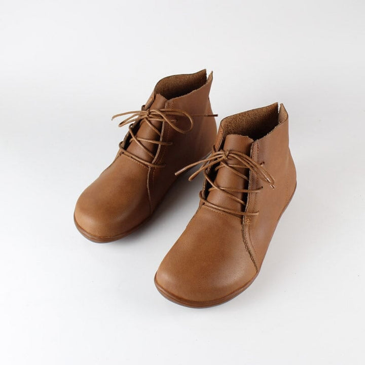 Close-up of Hazel ankle boots in brown showing sleek silhouette and contoured toe shape
