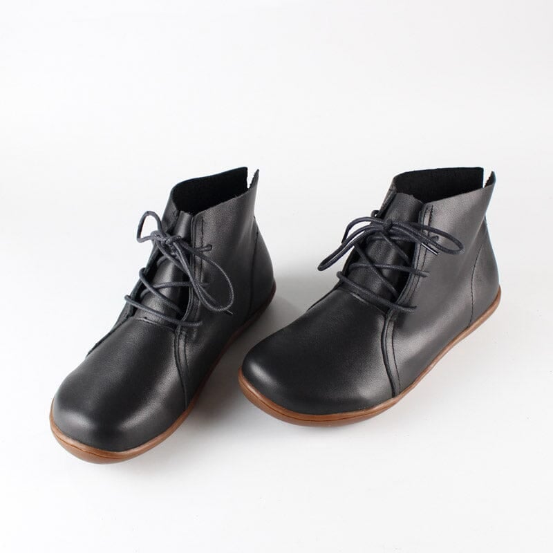 Hazel ankle boots in black displayed against a neutral background, highlighting smooth upper and supportive sole