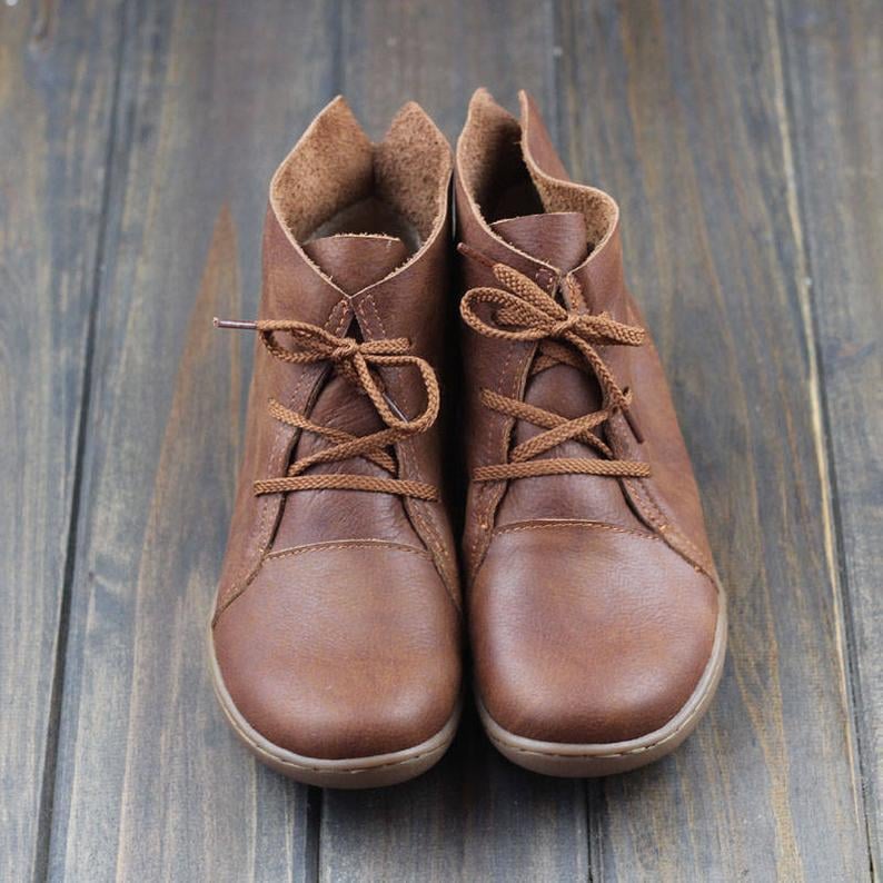 Side profile of Hazel ankle boots in brown showcasing leg-lengthening silhouette