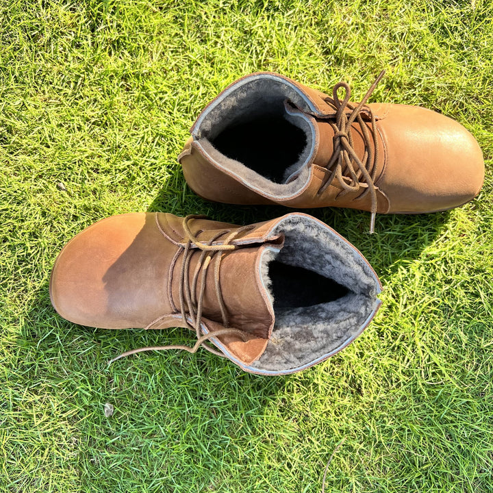 Detail shot of the sole and heel of Hazel ankle boots in brown