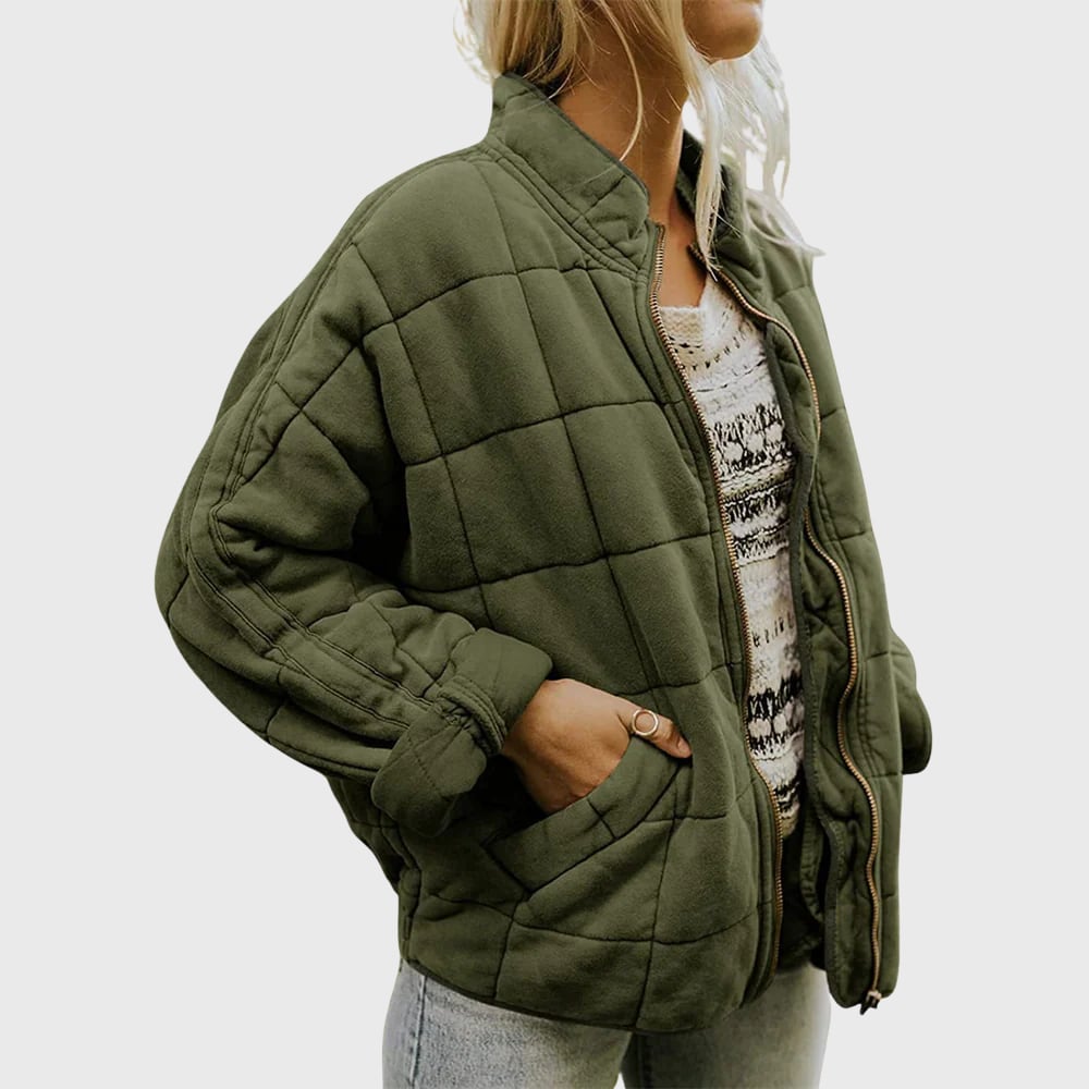 Woman wearing an elegant quilted jacket in a relaxed oversized fit, styled for a casual chic everyday look
