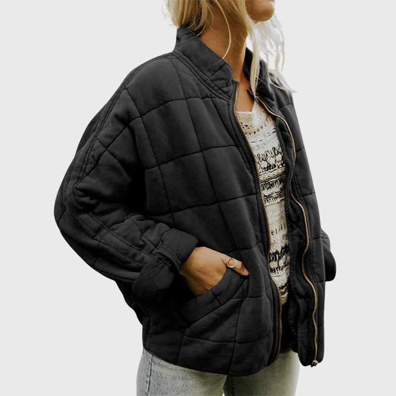 Close-up detail of the quilted texture on the Hazel elegant jacket showing lightweight insulation and refined stitching