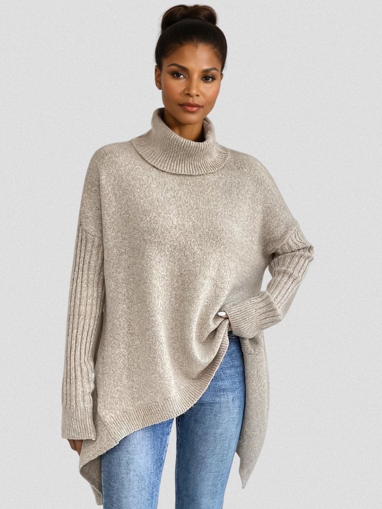 Model wearing the Hazel elegant long sleeve sweater in beige, styled with jeans for a polished casual look