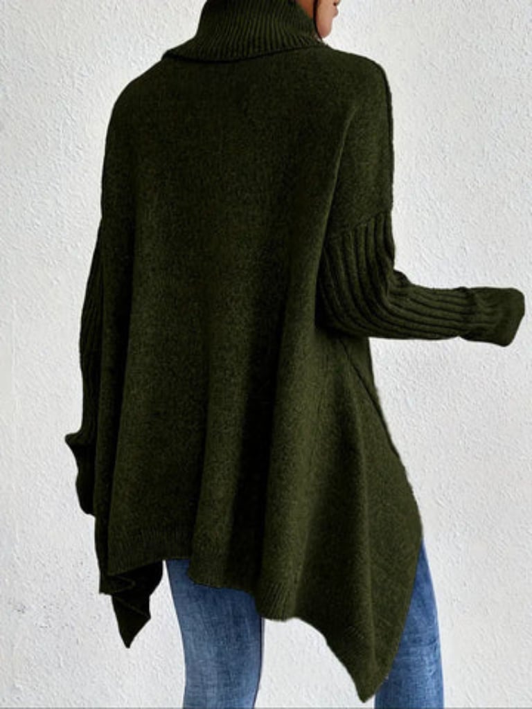 Model smiling wearing the Hazel sweater in blue, showcasing the comfortable everyday fit