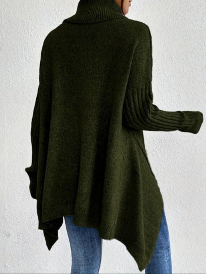Model smiling wearing the Hazel sweater in blue, showcasing the comfortable everyday fit
