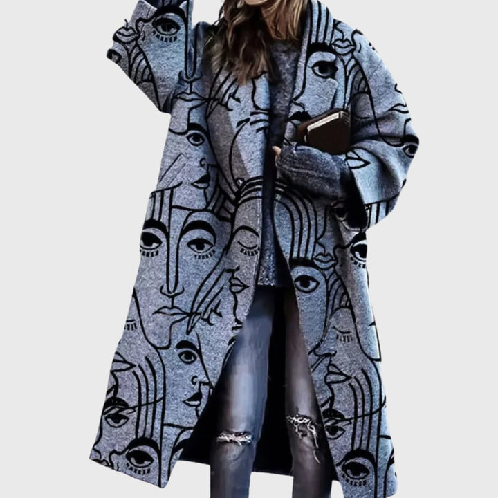 Close-up detail of the elegant longline coat showing premium fabric texture and refined design