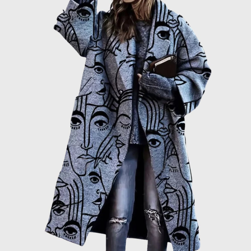Close-up detail of the elegant longline coat showing premium fabric texture and refined design