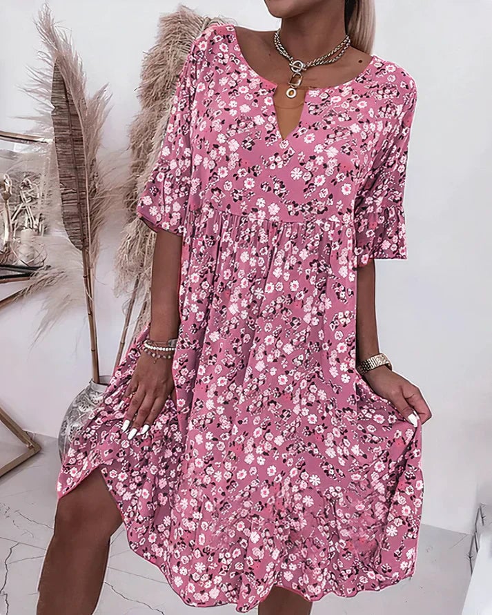 Woman wearing the Hazel elegant shift dress in pink, featuring a relaxed silhouette and lightweight fabric