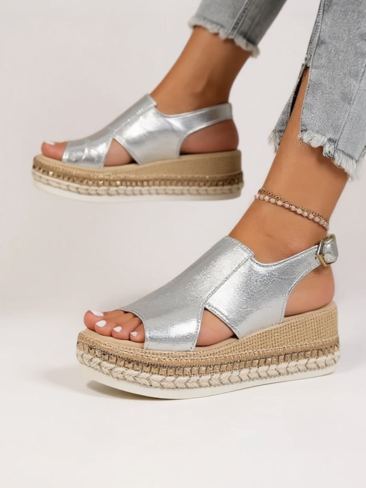 Side view of Hazel silver platform sandals showing the balanced platform sole and metallic strap