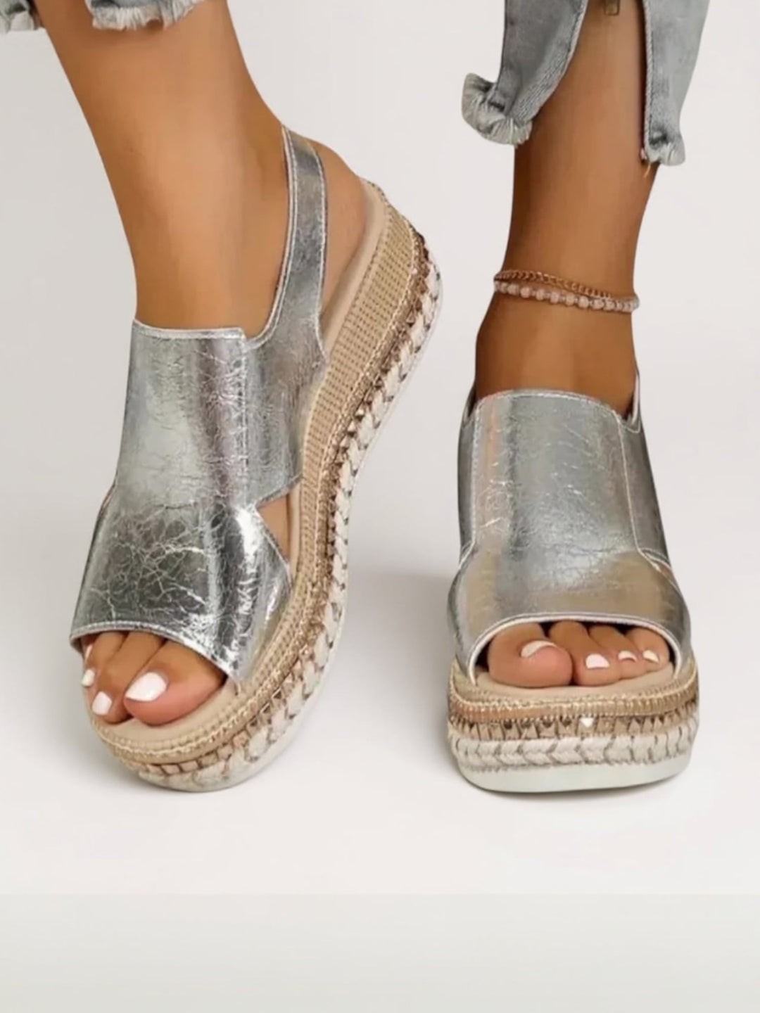 Hazel gold platform sandals styled on a model wearing a flowy summer dress