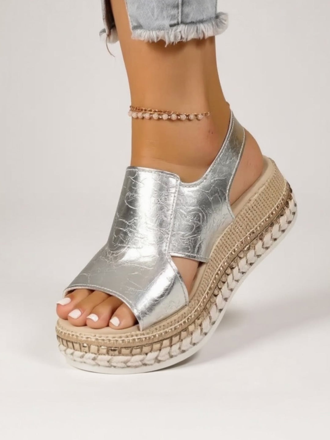 Overhead flat-lay of Hazel gold and silver metallic platform sandals side by side