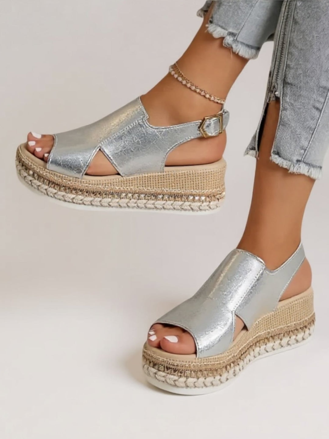 Back view of Hazel metallic platform sandals in silver showing the heel strap detail