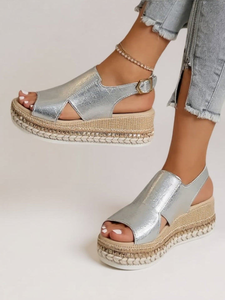 Back view of Hazel metallic platform sandals in silver showing the heel strap detail