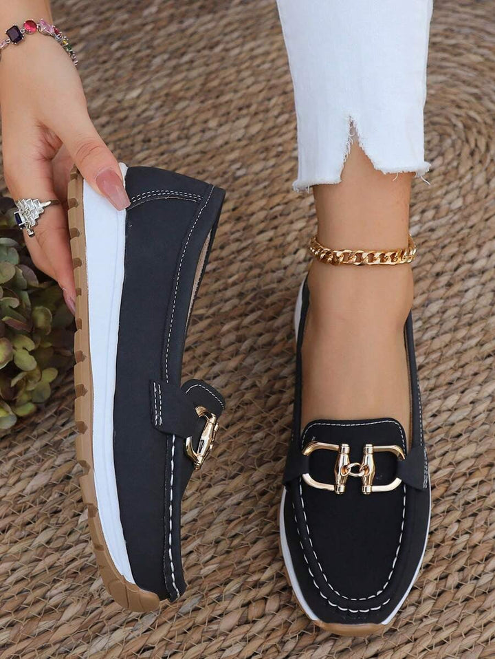 Hazzie women's navy chain bit slip-on loafers, front three-quarter view