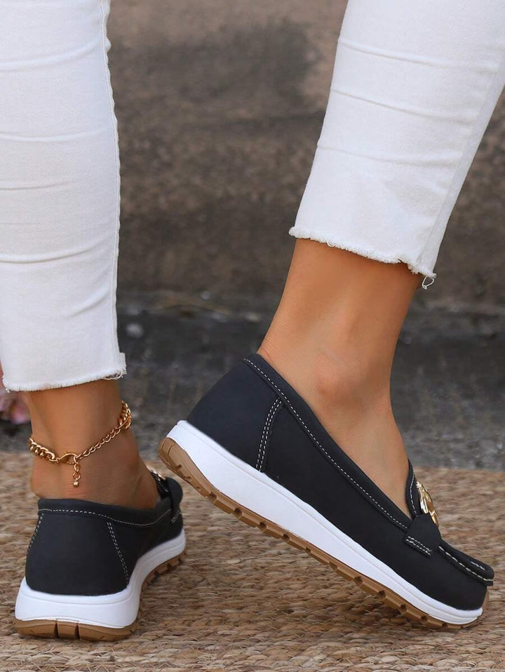 Grey Hazzie loafers overhead view showing slip-on construction and chain bit detail