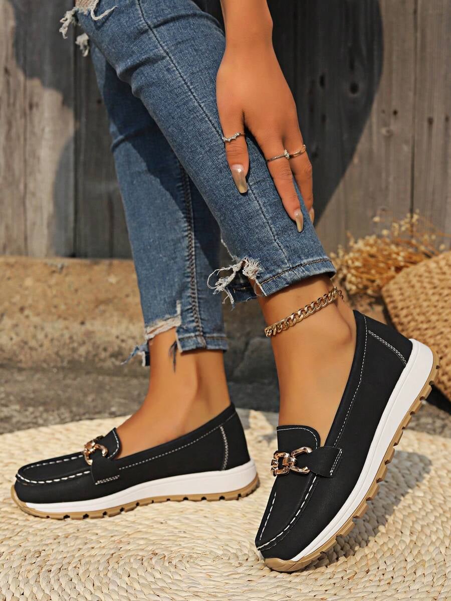 Brown Hazzie slip-on loafers side view with gold chain hardware accent