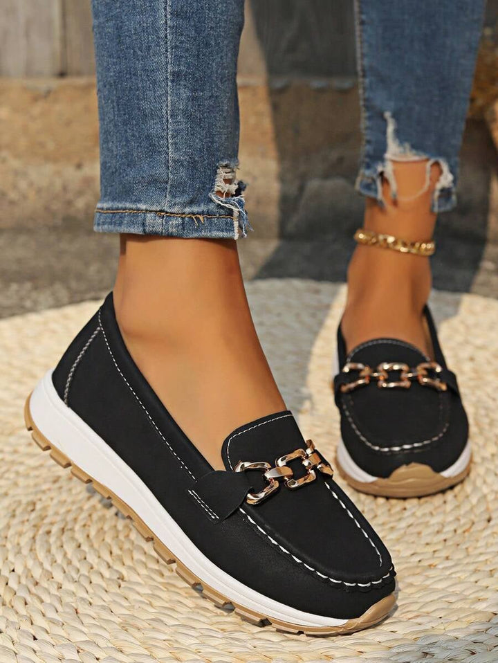 All four Hazzie loafer colorways — black, navy, grey, and brown — displayed together
