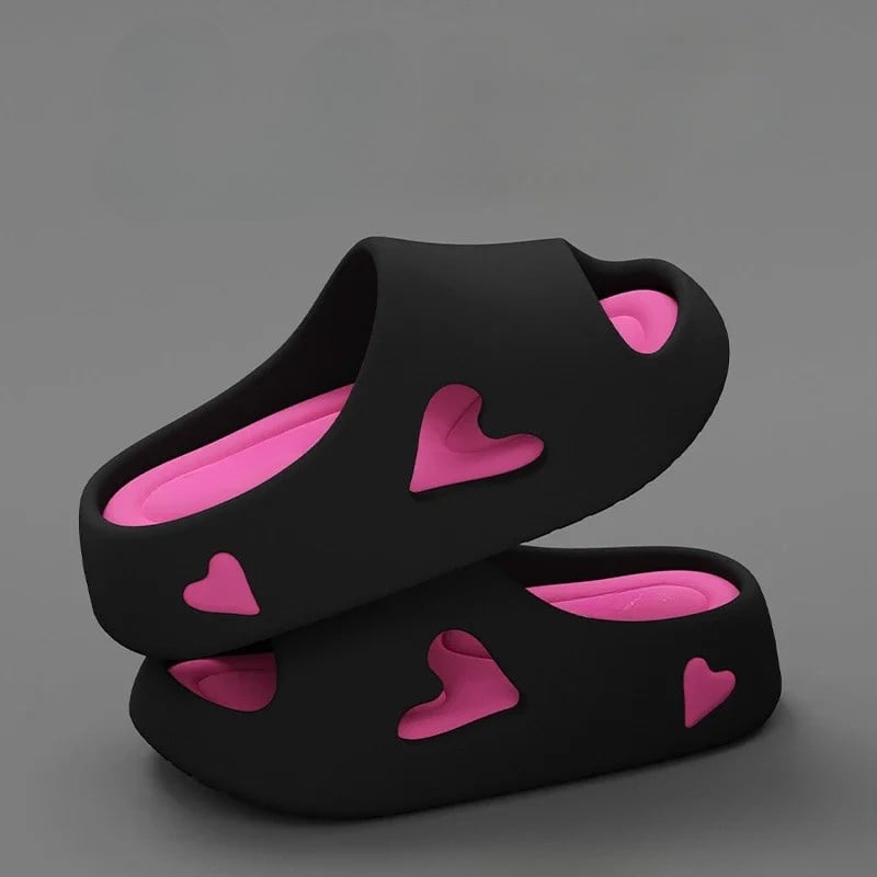 Soft heart flip flops in purple with heart-shaped cutout detail and cushioned platform sole