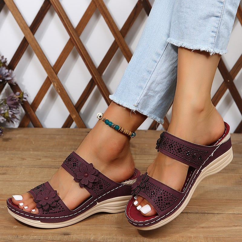 Heel and sole view of Heath wedge slides in light brown