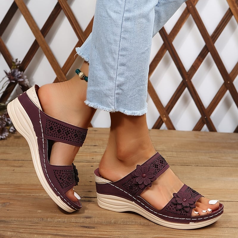 Model wearing Heath navy blue wedge slides on a sunny day