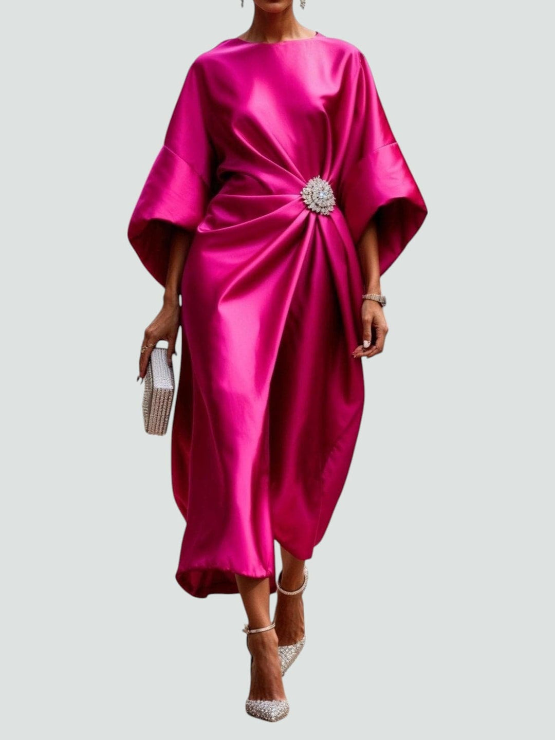 Side profile of the Heather long dress in Turquoise highlighting the flowing floor-length drape